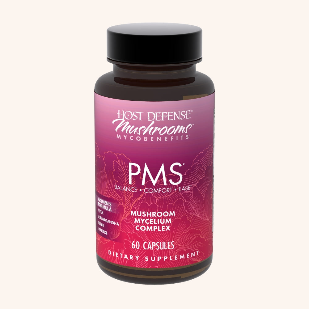 Supplement bottle labeled 'PMS' by Host Defense on a white background