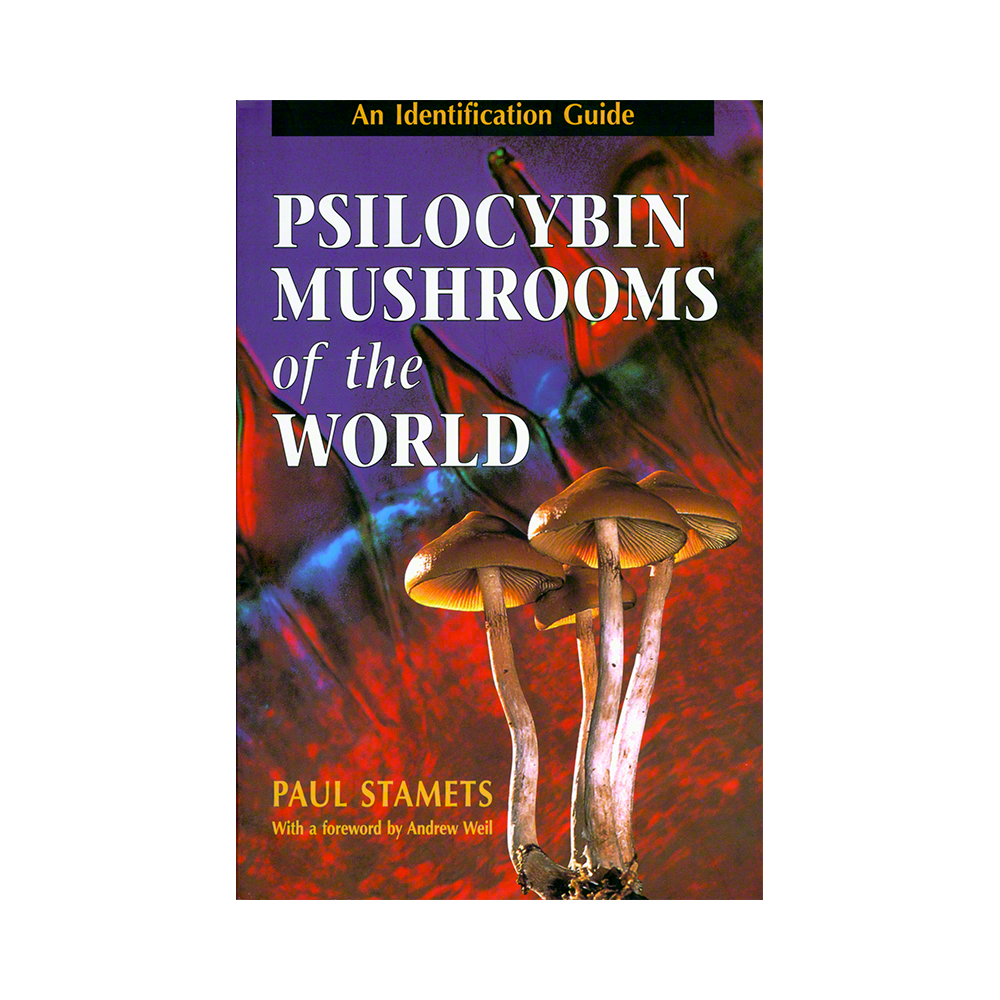 Book cover for 'Psilocybin Mushrooms of the World: An Identification Guide' by Paul Stamets, featuring a vibrant background of red, orange, and purple with detailed mushrooms in the foreground.